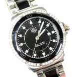 A Tag Heuer Formula 1 diamond set lady's wristwatch, circular black dial with diamonds at intervals,