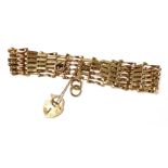 A 9ct gold six bar gate bracelet, on a heart shaped padlock clasp, with safety chain as fitted, 6.5g