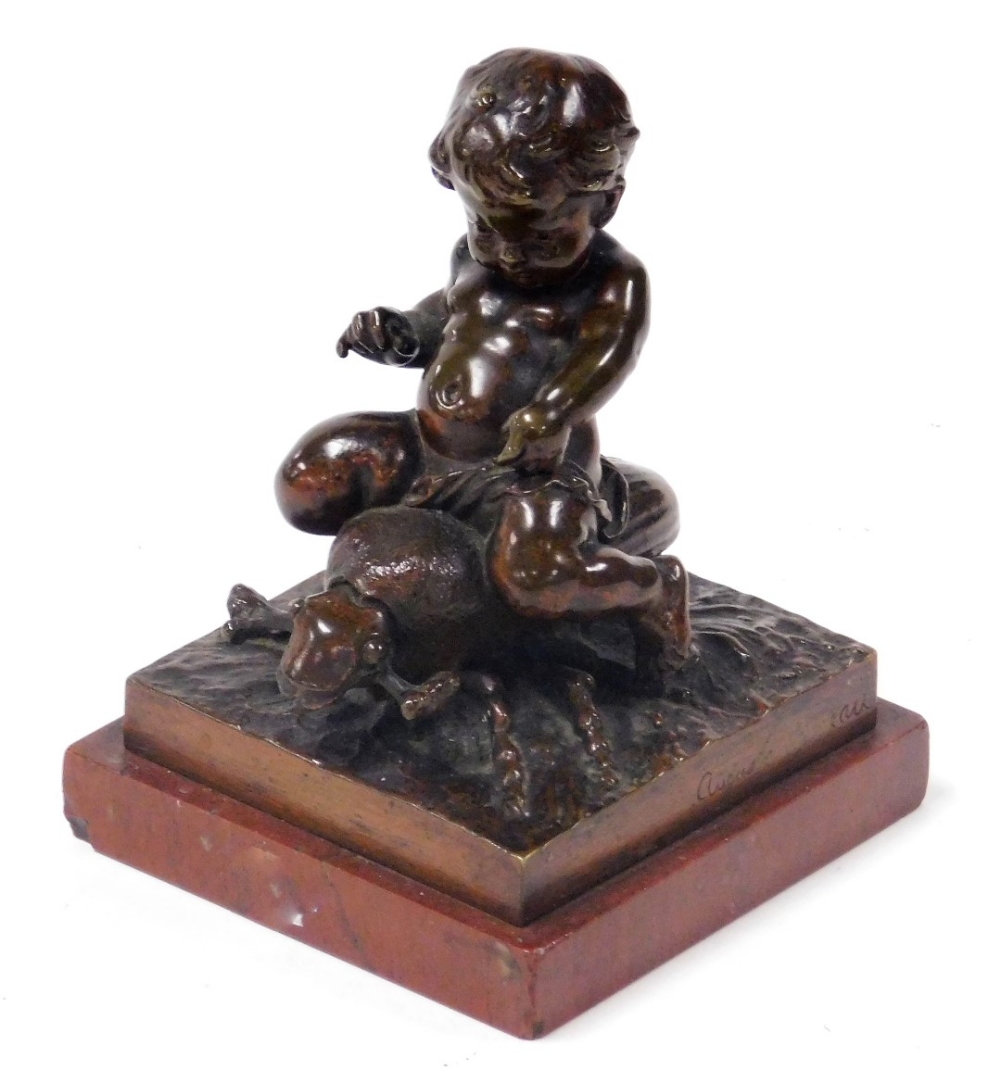 Auguste Moreau (French 1834-1917). A bronze sculpture of a putto riding a beetle, raised on a natura
