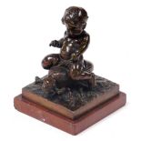 Auguste Moreau (French 1834-1917). A bronze sculpture of a putto riding a beetle, raised on a natura