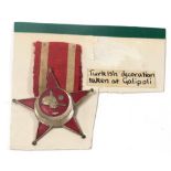 A World War I Ottoman Gallipoli Star, with ribbon.
