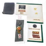 A Japanese World War II diary, military labels and badges, together with four Soviet Union lapel bad