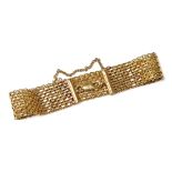 A 9ct gold mesh bracelet, on a lobster claw clasp, with safety chain as fitted, 15.9g.