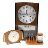 A mid century Seiko thirty day wall clock, with calendar, 43.5cm high, together with a Smiths wooden