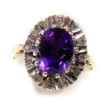 A 9ct gold amethyst and diamond ring, in an oval setting, size L/M, 3.4g.