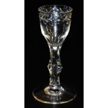 A late 18thC Georgian wine glass, the bowl engraved with a repeating floral and foliate pattern, rai