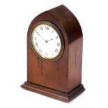An early 20thC mahogany cased mantel clock, the circular dial bearing Roman numerals, Buren clockwor