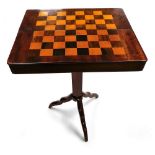 A Victorian mahogany campaign games table, with a rosewood and satinwood chess board top, the box op