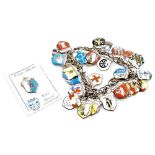 An early 20thC German silver and enamel charm bracelet, set with shields of various cities, towns, a