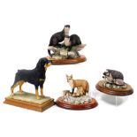 A Border Fine Arts figure of a Rottweiler, on a wooden base, figure group of otters, and two further