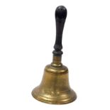 A brass bell, with a turned lignum vitae handle, 34cm high.
