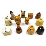 A group of pottery novelty honey pots, in the form of beehives, honey bears, etc.