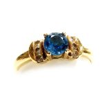 A 9ct gold and aquamarine ring, with diamond set shoulders, size P, 1.8g all in.