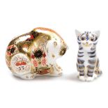 Two Royal Crown Derby porcelain paperweights, comprising Imari Polar Bear, silver stopper and red pr