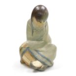 A Lladro matte porcelain figure of an Eskimo girl, in seated position, printed and impressed marks,