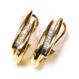 A pair of bicolour and diamond set earrings, baguette cut in a channel setting, in yellow metal, 6.5