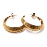 A pair of 9ct gold hoop earrings, with engraved foliate decoration, 3.8g.