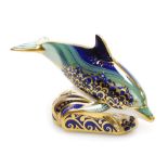 A Royal Crown Derby porcelain Lyme Bay Baby Dolphin paperweight, a signature edition of 1500 for Gov