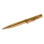 A 9ct gold propelling pencil, the screw top containing leads, 27.5g all in.