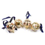 Four Royal Crown Derby porcelain Christmas baubles, of globular form with tier drop, Royal Crown Der