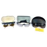 Three pairs of designer sunglasses, comprising Cabouchon, Bruce Oldfield, and another pair, boxed. (