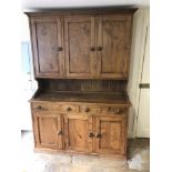 A 19thC style oak dresser, with cabinet top with three panelled doors, the base with three drawers a