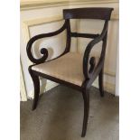 A William IV mahogany carver chair, with overrun cresting rail, drop in seat and sabre legs, 82cm hi