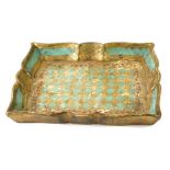 An Eastern papier mache tray, with fluted border on a turquoise ground with gilt and red decoration,