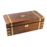 A 19thC walnut campaign writing box, with brass bound supports and escutcheon, with writing slope wi