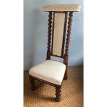 A Victorian elm Prie Dieu chair, with barley twist supports, 103cm high.