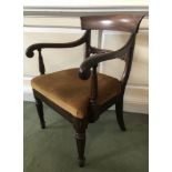 A William IV mahogany carver chair, with scroll arms, on turned legs.