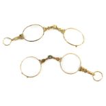 Two pairs of yellow metal framed spectacles, unmarked.