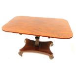A William IV mahogany breakfast table, the rectangular top with moulded corners on a snap clasp, wit