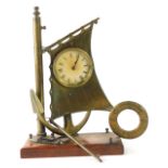 A novelty brass ship's clock, the Roman numeric clock set within the mast and anchor of a ship, on