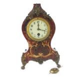 A 20thC Boulle mantel clock, with white ceramic numeric dial, 12cm high.