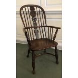 A 19thC ash and elm high back Windsor chair, with Christmas tree splat, and crinoline stretcher.