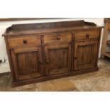 A 19thC style oak dresser base, with a raised back and an arrangement of three drawers and three pan