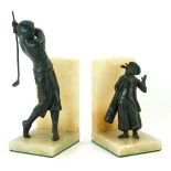 Two onyx and spelter golfer book ends, comprising gentleman in swinging pose, and child caddy, 25cm