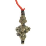 A white metal and coral childs rattle, the embossed floral body with three bells, on coral stem, whi