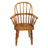 A 19thC ash and elm child's Windsor chair, with solid seat, 68cm high, 33cm wide, 25cm deep.