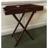 A 19thC mahogany butler's tray, with a folding stand, 96cm high, 80cm wide, 50cm deep. (2)