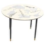 A 1960/1970's melamine topped circular coffee table, with printed decoration of musical instruments
