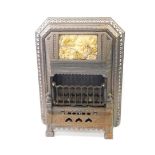 A Victorian cast iron and enamel gas fire by T Fletcher of Warrington, cast with leaves, the hood be