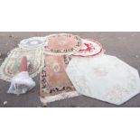 A group of modern Chinese wool cut rugs, table cover, two round rugs, three oval and one square.