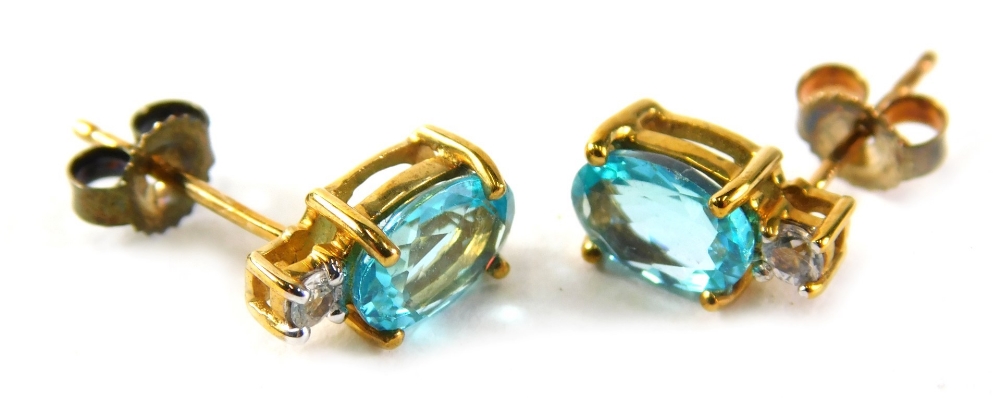 A pair of 9ct gold aquamarine and cz drop earrings, each with a single pin back on later butterfly b
