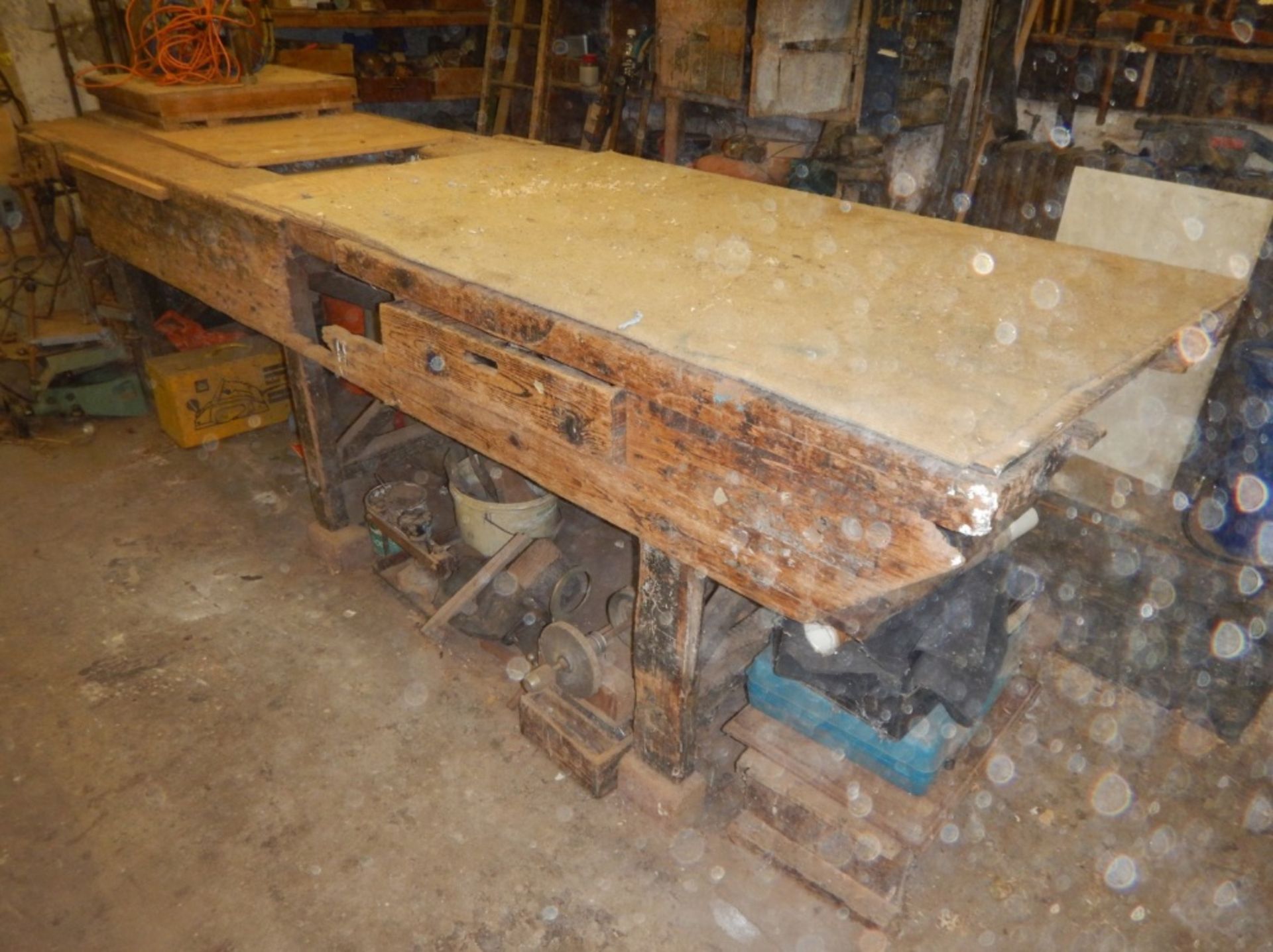 A large Victorian pine work bench, fitted with a drawer, and three Record bench vices, 335cm x 97cm
