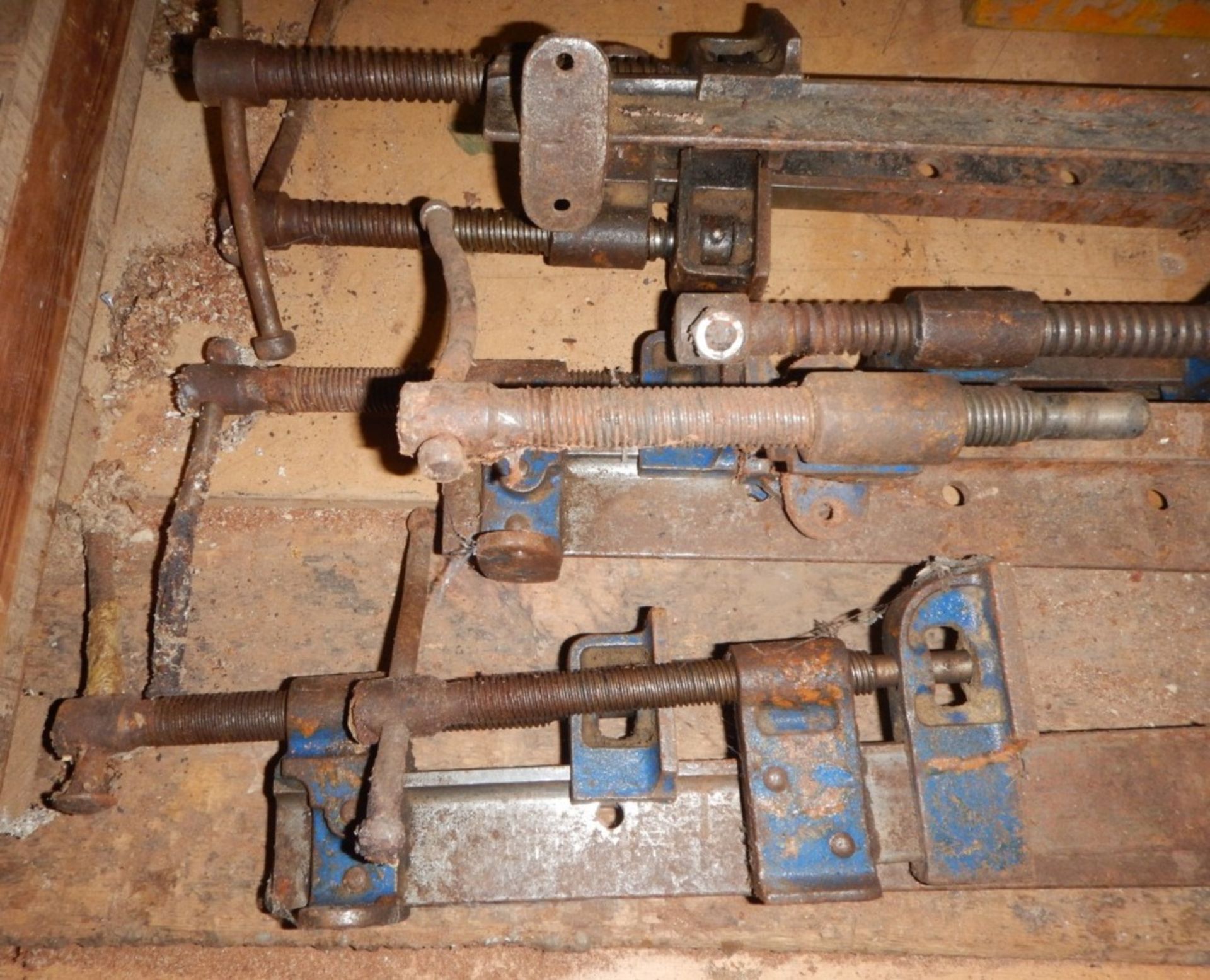 A collection of sash clamps.