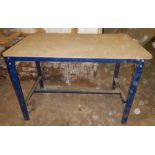 Metal frame work bench with plywood top.