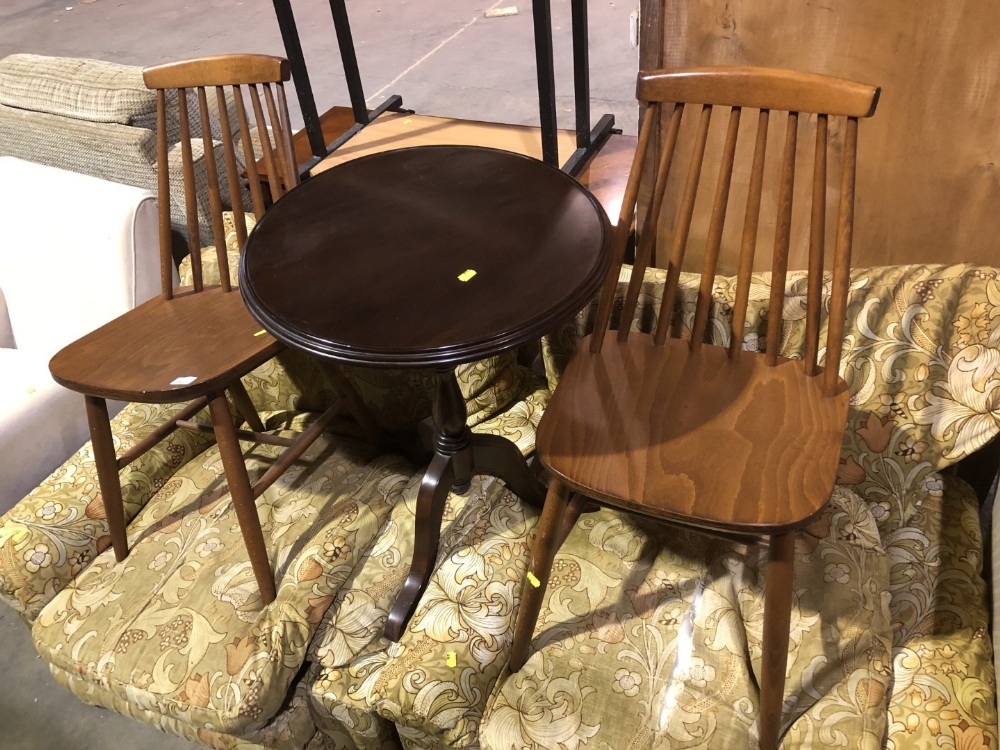 A pair of spindle back kitchen chairs, and a reproduction mahogany pedestal table. (3) This lot is a
