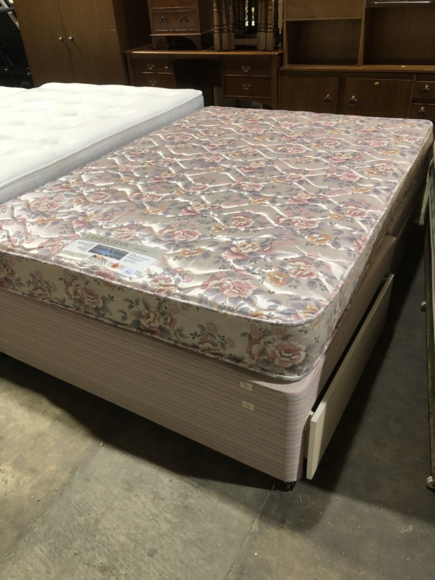 A double bed with divan base. This lot is available to view Tuesday 15th 10am to 4pm at our temporar